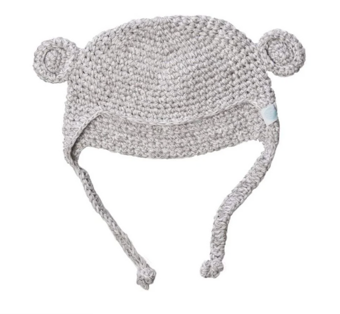 Knitted baby hat with bear ears on a white background