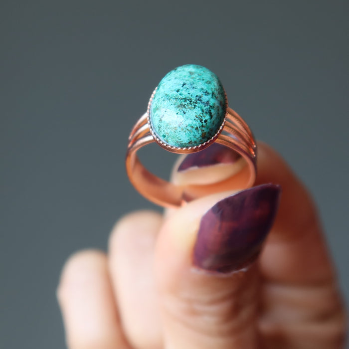hand holding chrysocolla copper ring