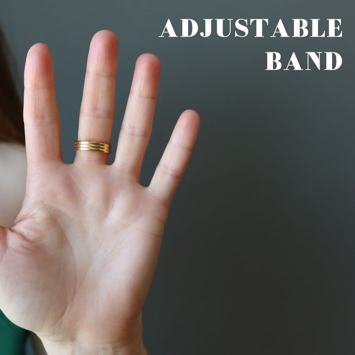 female wearing tigers eye gold ring showing adjustable band