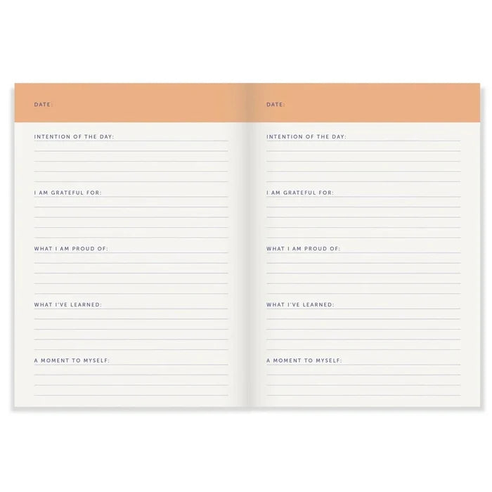 Open planner with daily reflection sections on a white background
