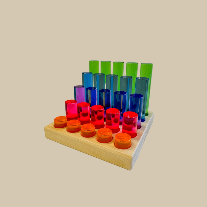 Colorful shot glass holder with wooden base on a beige background