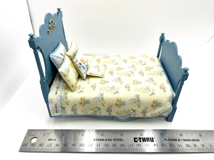 Blue Bedroom Set With Yellow Floral Patterned Bedspread