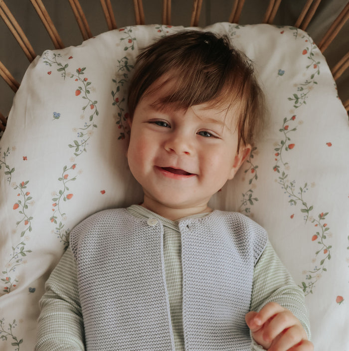 Botanical Berries Crib Sheet with baby boy laying in crib