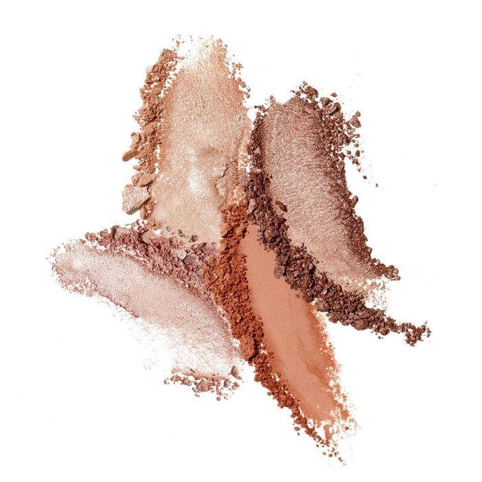 Various warm-toned, shimmering bronzer powders artistically spread on a white background showcasing shades for natural glowing skin with Bronzers Refill | Jane Iredale.