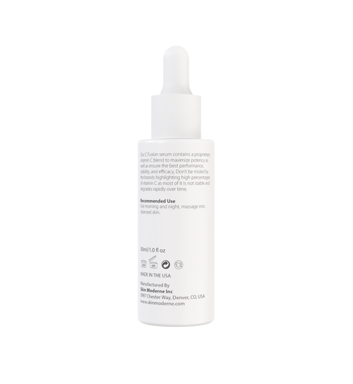 White dropper bottle of C Fusion | Skin Moderne serum with text describing vitamin C blend, recommended use, and manufacturing details visible on label.