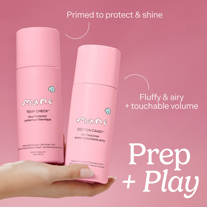 Two pink hair care products held by a hand with promotional text on a pink background