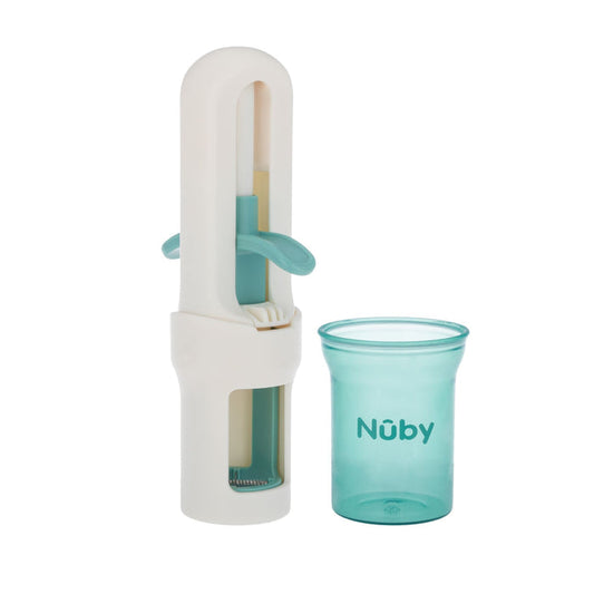 The Nuby Grape Cutter | Aqua is a white and teal feeding accessory with a built-in cutter to reduce choking risk, featuring a cylindrical masher and a small transparent cup labeled “Nuby.”.