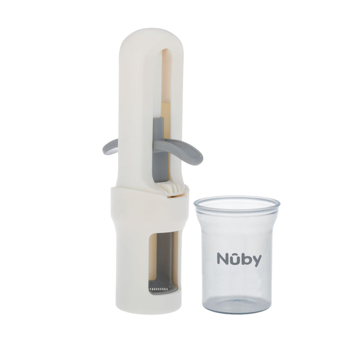 A gray and white Nuby Grape Cutter with a clear cup, designed for safe and easy fruit preparation, is displayed side by side against a plain white background.