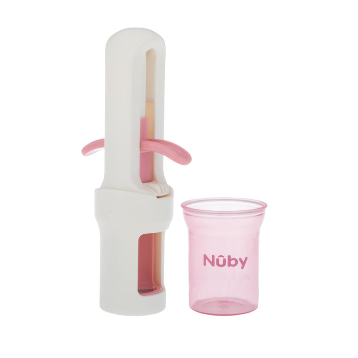 The Nuby Grape Cutter in pink, shown with a side handle next to a small translucent pink measuring cup labeled “Nuby,” is ideal for preparing baby food and ensures safe, easy serving of grapes or other small foods.