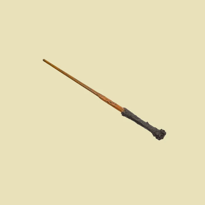 Wooden wand with a dark brown handle on a white background