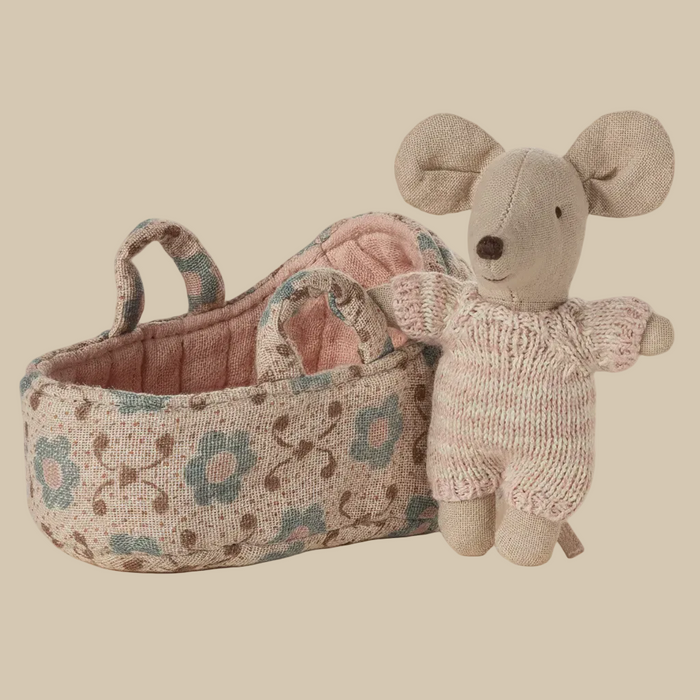 Knitted mouse toy with floral-patterned basket on a white background