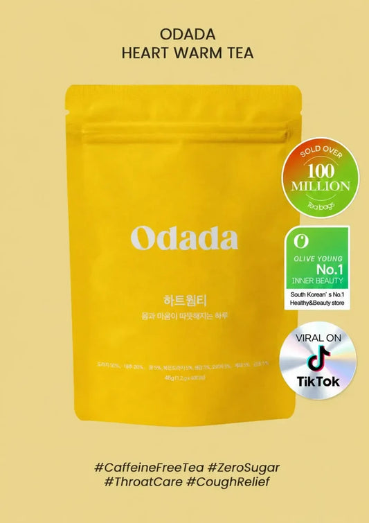 A yellow stand-up pouch of Odada Heart Warm Tea centered on a pale yellow background, with product text at the top and badge-style callouts on the right including 'HOLD OVER 100 MILLION' and 'VIRAL ON TikTok'.