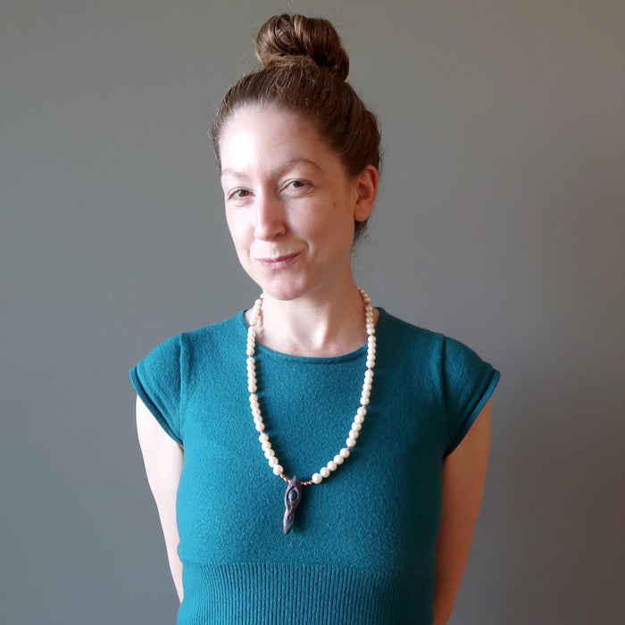 woman modeling pearl goddess necklace
