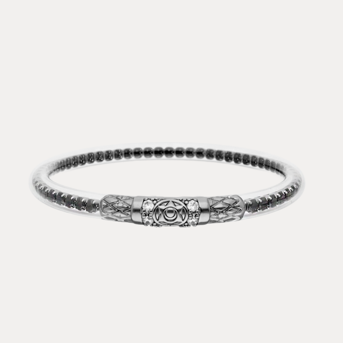 a silver bracelet with a design on it
