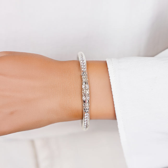 a close up of a bracelet on a wrist