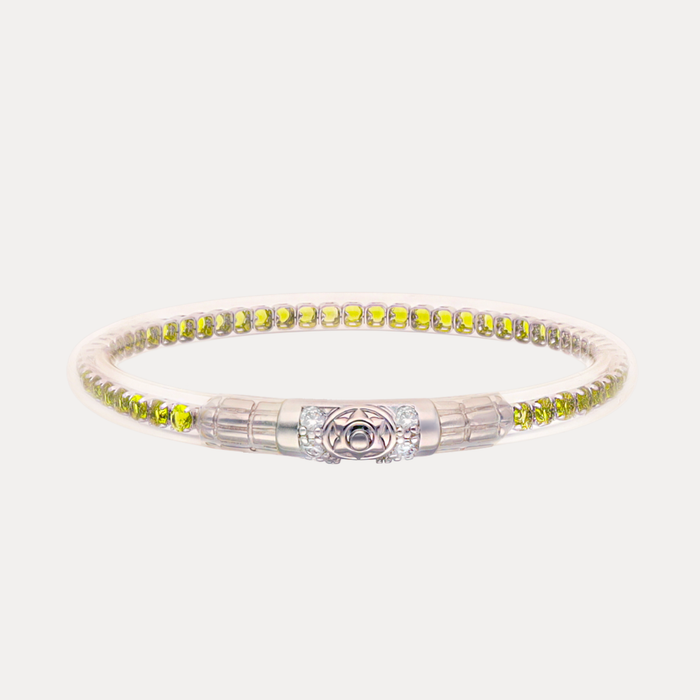 a silver bracelet with yellow stones