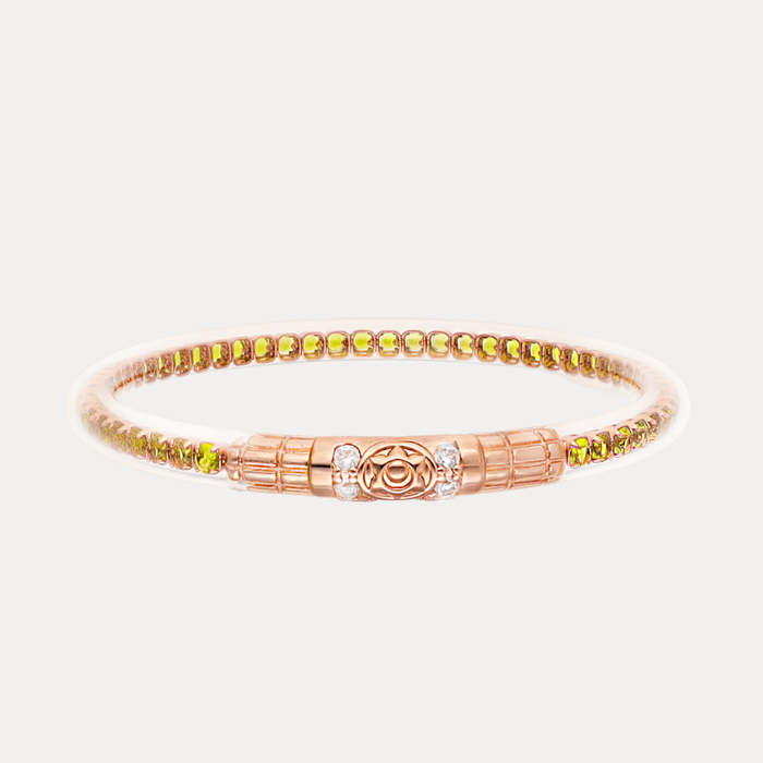 a gold bracelet with diamonds and gems