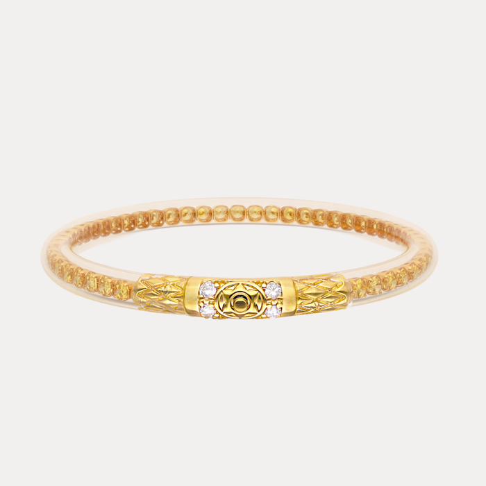 a gold bracelet with a gold band