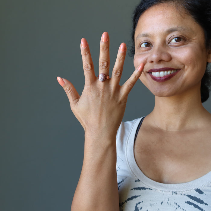 sheila of satin crystals wearing a rhodochrosite ring