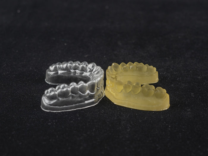 high temperature resin 3D printed dental models clear and yellow aligner molds