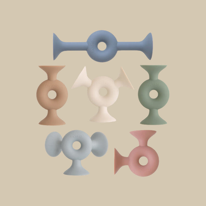 Set of colorful silicone shapes with suction cup ends.