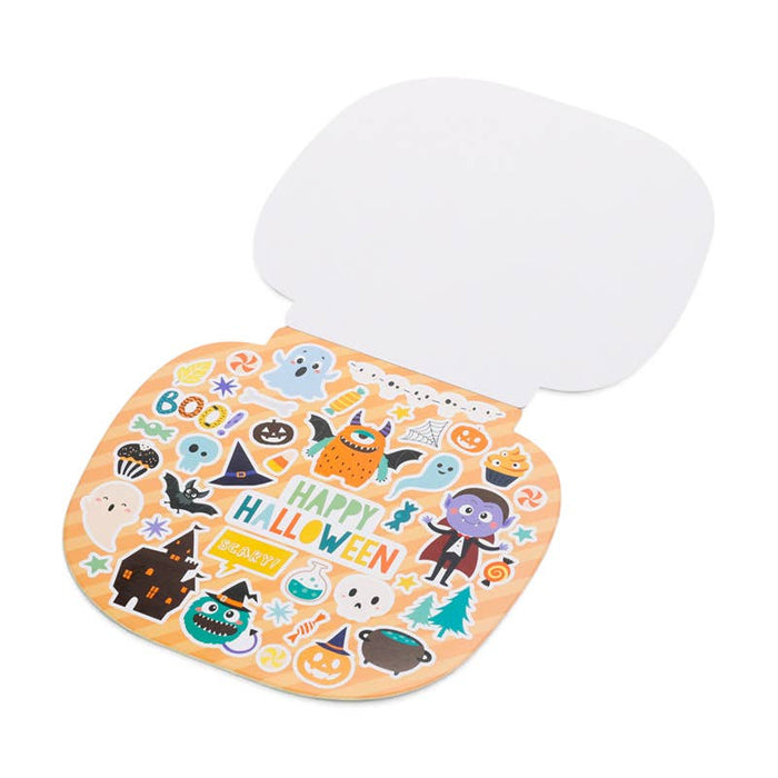 A Halloween-themed mouse pad with a white top surface and an orange bottom surface decorated with colorful stickers of pumpkins, ghosts, witches, and 'Happy Halloween' text, shown on a white background.