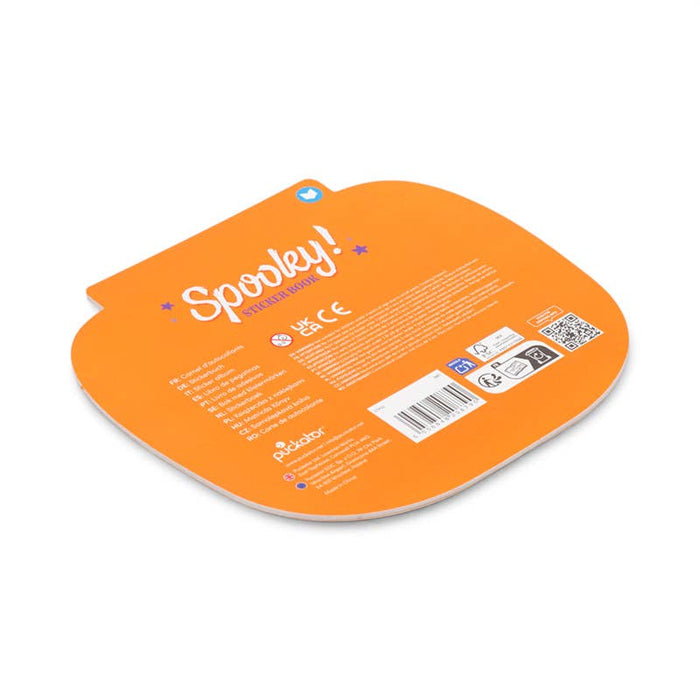 The back of an orange Spooky! Halloween toy packaging card, featuring product details, safety regulations, and a barcode, on a solid white background.