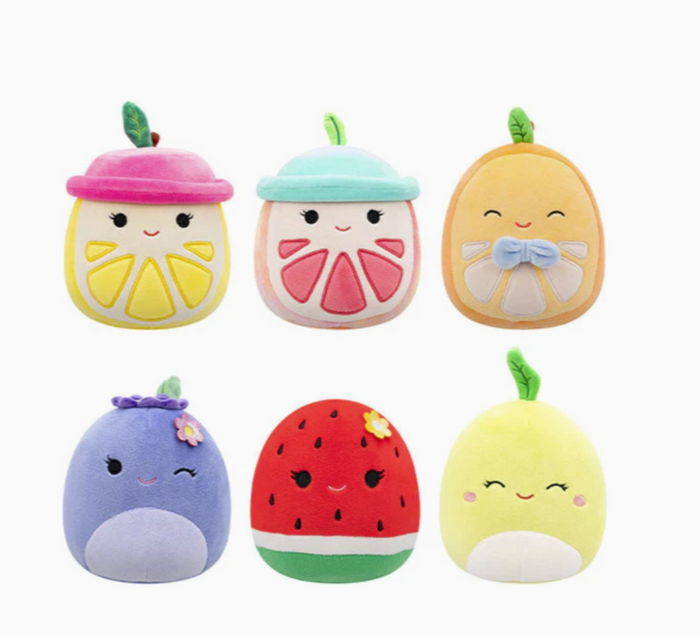 Set of colorful plush toys shaped like fruits and vegetables on a white background