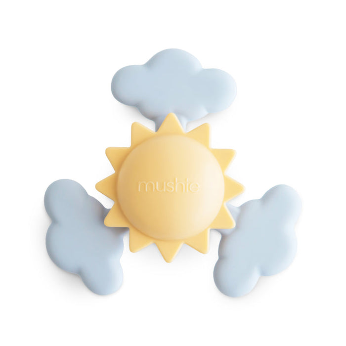 Sun and cloud-shaped toy with 'mushie' branding on a white background