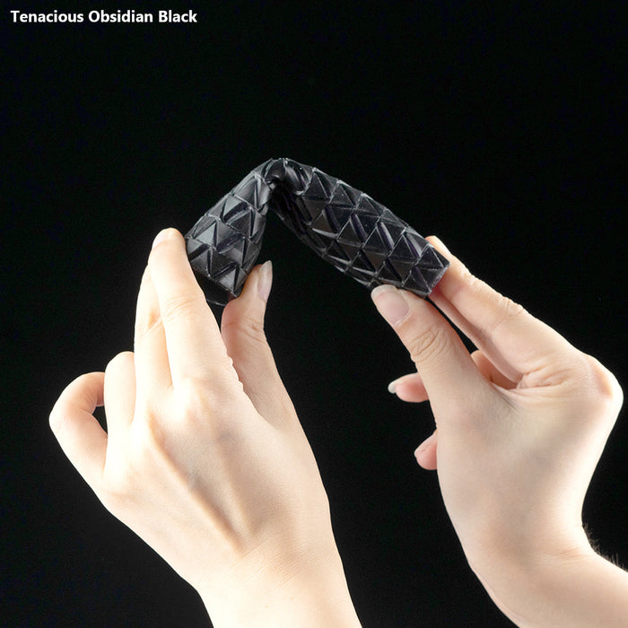 flexible 3D printing resin obsidian black print bent by two hands showing extreme flexibility