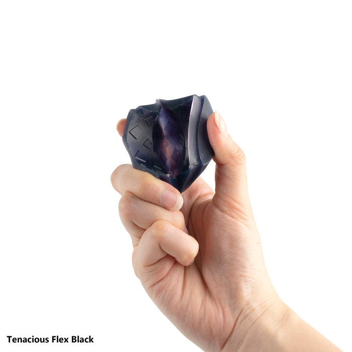 flexible 3D printing resin black crumpled diamond-pattern print held in fist showing flex