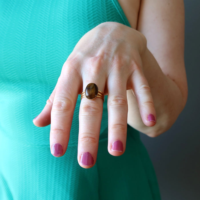 female wearing tigers eye gold ring