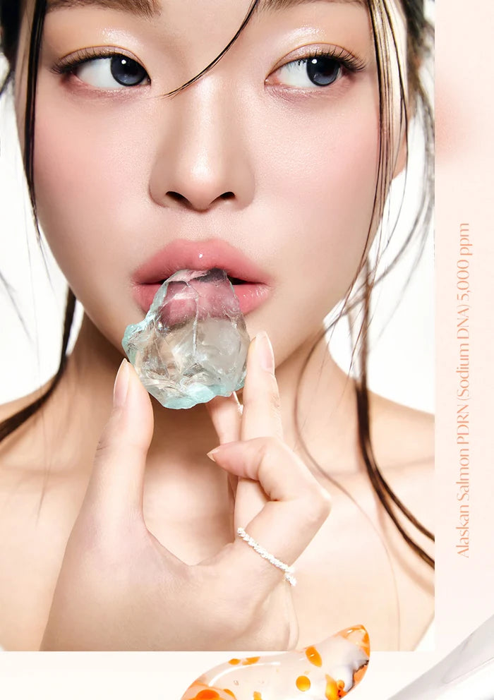Woman holding a piece of ice in her hand with a white background